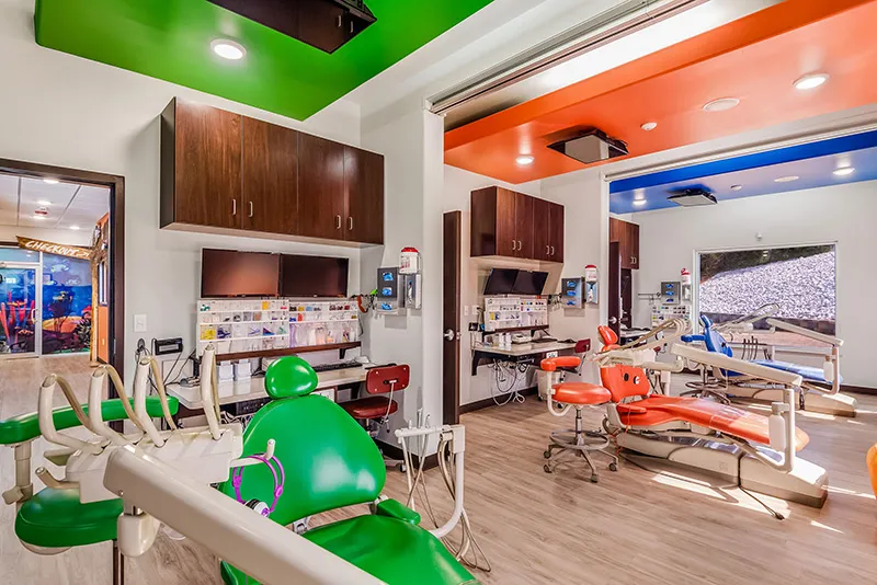 Operatory bays with brightly colored ceilings — green, orange, blue